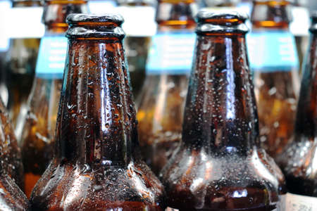 wet glass beer bottle ready for recyclingの写真素材