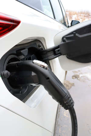 Charging up EV, electric vehicle with electricityの写真素材