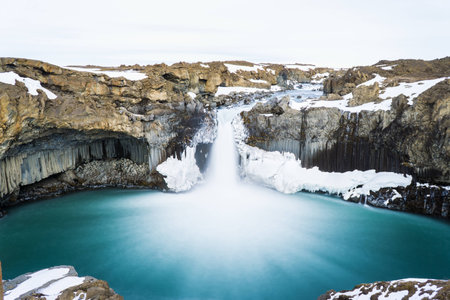 Mysterious huge waterfall among mountainの写真素材
