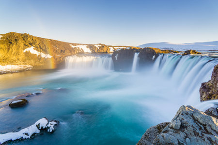 Huge waterfall with rainbows in Icelandの写真素材