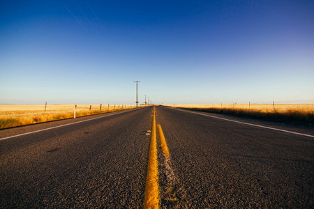 Road with vanishing lines leading foreverの写真素材