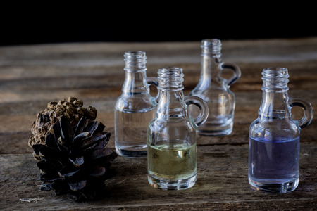 oil bottle with fruits and vegetables on old tableの写真素材