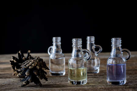 oil bottle with fruits and vegetables on old tableの写真素材