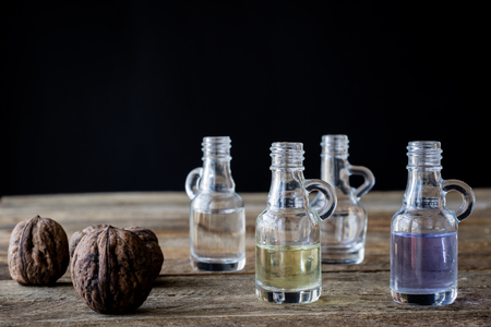 oil bottle with fruits and vegetables on old tableの写真素材