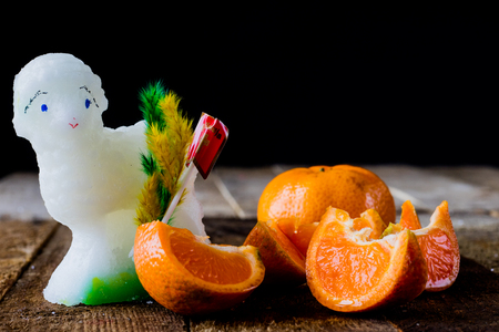 Mandarin, strawberry and chocolate on an old wooden table in an old kitchen on a black backgroundの写真素材