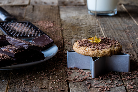 chocolate cookies on an old wooden table, black backgroundの写真素材