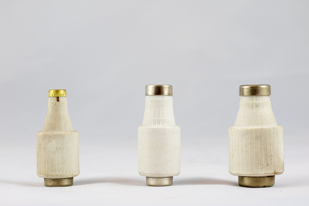 Old electric fuses on white isolated backgroundの写真素材