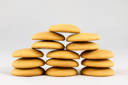 Dry biscuit cakes on white isolated background with jute napkin