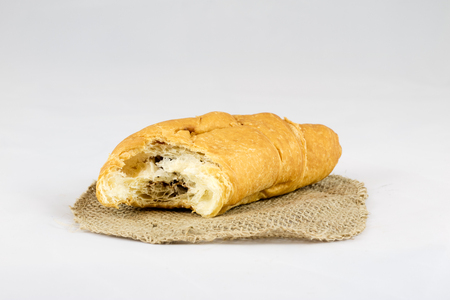 Dry biscuit cakes on white isolated background with jute napkinの写真素材