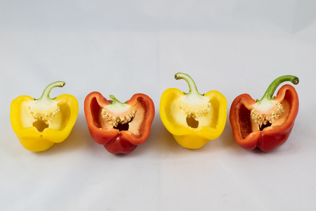 Tasty and delicious red and yellow peppers, isolated on white backgroundの写真素材