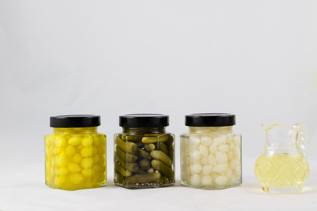 Wonderful vegetable preserves in a kitchen pantry on a white isolated backgroundの写真素材