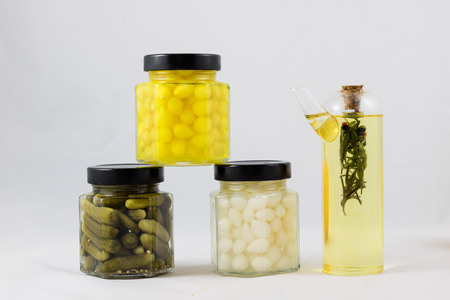 Wonderful vegetable preserves in a kitchen pantry on a white isolated backgroundの写真素材