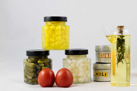 Wonderful vegetable preserves in a kitchen pantry on a white isolated backgroundの写真素材