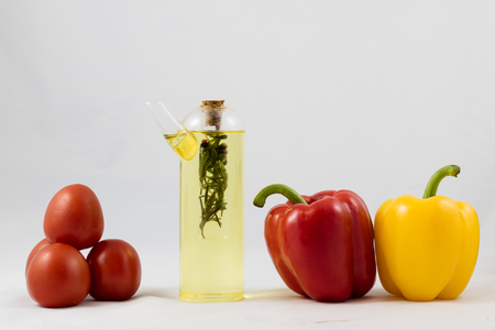 Wonderful Italian food, peppers, tomatoes and olive oil isolated on white backgroundの写真素材