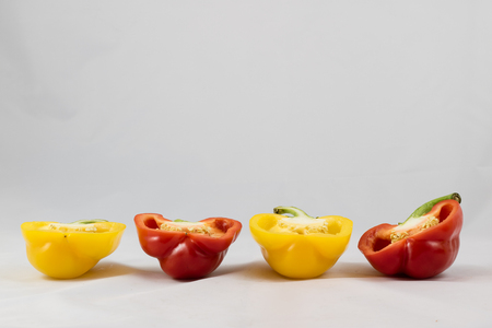 Tasty and delicious red and yellow peppers, isolated on white backgroundの写真素材