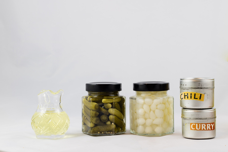 Wonderful vegetable preserves in a kitchen pantry on a white isolated backgroundの写真素材