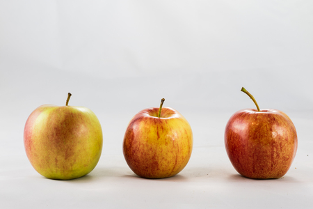 Tasty ripe apples on white isolated backgroundの写真素材