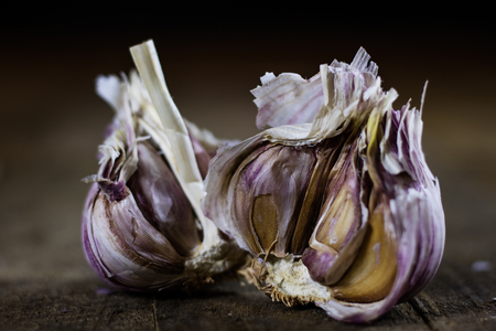 Tasty Italian garlic in an old kitchen on a wooden table, vintage styleの写真素材