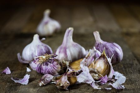 Tasty Italian garlic in an old kitchen on a wooden table, vintage styleの写真素材