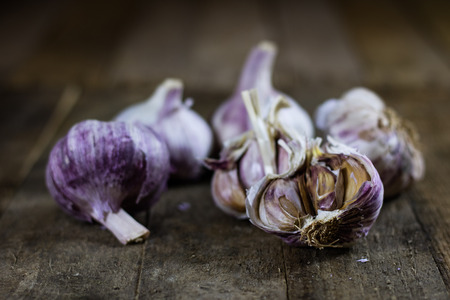 Tasty Italian garlic in an old kitchen on a wooden table, vintage styleの写真素材