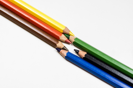 Cute baby pencil crayons on a white table. Isolated background. White background.の写真素材
