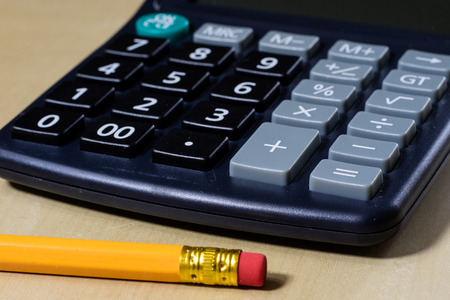 Bills, documents and papers with calculator. Office of the accounting office. Wooden table.の写真素材