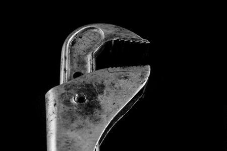 Rusty, old workshop keys. Hydraulic keys on a black table in a workshop.の写真素材