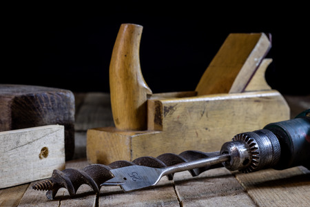 Old good carpentry, tools drill bit. Wooden carpentry table and old good carpentry tools on it....