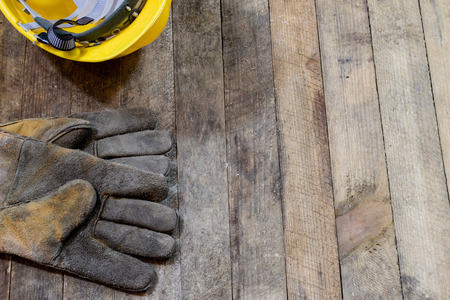 Tools on a wooden table in an old workshop. Arranged on the edge of the table. wooden table, black background.の写真素材
