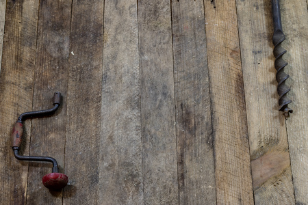Tools on a wooden table in an old workshop. Arranged on the edge of the table. wooden table, black...