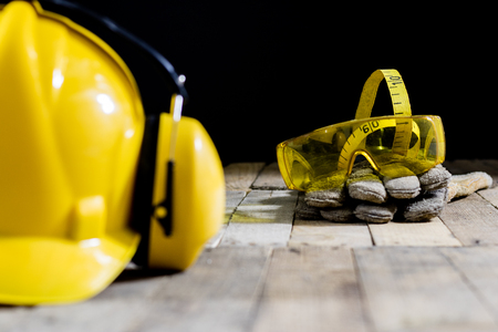 helmet, hearing protection, tools, workshop table. Safety equipment and tools.の写真素材