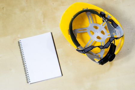 helmet, hearing protection, tools, workshop table. Safety equipment and tools.の写真素材