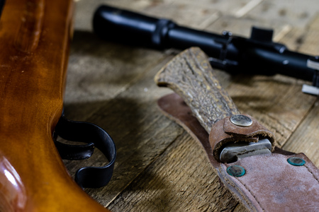 shooting, pneumatic and firearms on a wooden table. Table on the shooting range, weapons and shooting accessories. black backgroundの写真素材