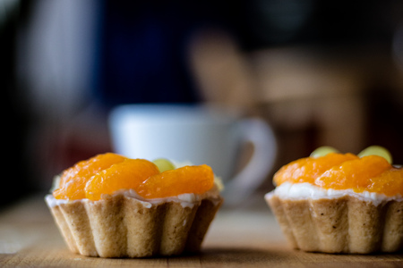 Tasty muffin with fruit on a wooden table. Hot tasty coffee in a cup. Atmosphereの写真素材