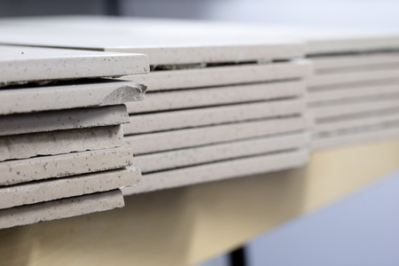 Cut tiles on the floor stacked. Tiles and masonry rugs for laying tiles. Tile workshopの写真素材