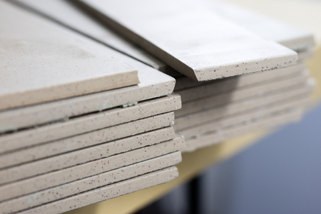 Cut tiles on the floor stacked. Tiles and masonry rugs for laying tiles. Tile workshopの写真素材