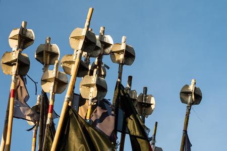 Fishing port, flags fluttering on stilts on fishing nets. Fishing nets in the port. Autumn season.の写真素材