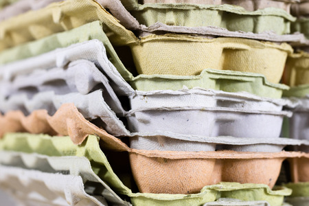 Eggs in molds on a wooden kitchen table. Hen egg in the kitchen atmosphere. black backgroundの写真素材