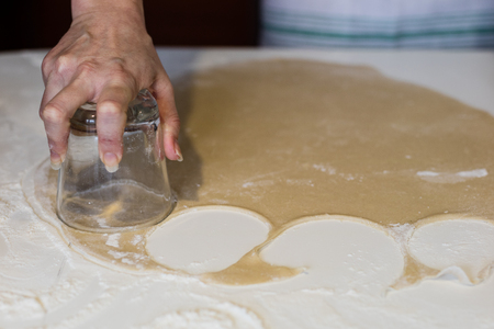 Tasty dumplings with potato filling. Making dumplings in the kitchen. Dumplings on a white table.の写真素材