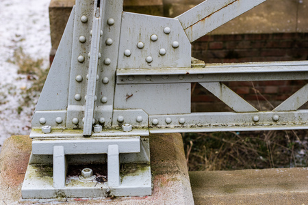 Steel construction, lattice connected by an old method for rivets. Truss in the old bridge connected...