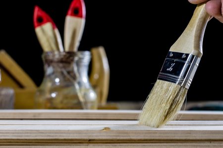 Carpentry tools on a wooden table in an old carpentry workshop. Old carpentry learning. Black background.の写真素材
