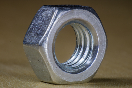 Mechanical accessories in high magnification. Screw cap in macro technology. Black background.