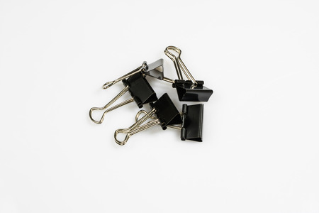 Colorful office paper clips isolated on white ground. Office accessories on a white table. White...