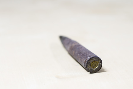 Old German rifle ammunition. Rifle cartridge from the time of World War II. Black background.の写真素材