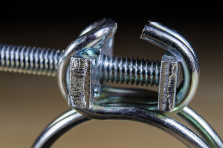 Bolts and screws for metal on a workshop table. Joinery accessories for furniture repair. Light...
