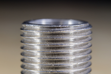 Bolts and screws for metal on a workshop table. Joinery accessories for furniture repair. Light...