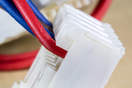 Electrical connectors at high magnification. Computer and electrical clamps and plugs shown in macro technology. Light background.の写真素材