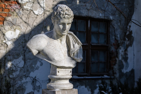 The sculpture is set in a park next to the historic Teutonic castle. Bust at the park path. Season winter.のeditorial素材