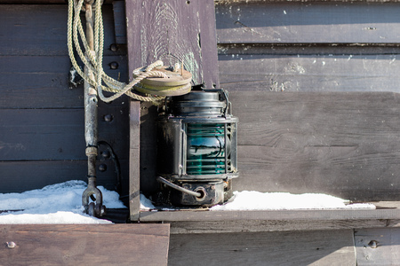 Ship signal lamp. Ship lighting on board a floating vessel in the port. Winter seasonの写真素材