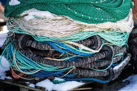 Fishing boats in the Polish fishing port on the Baltic. Fishing accessories, nets and ropes on a...